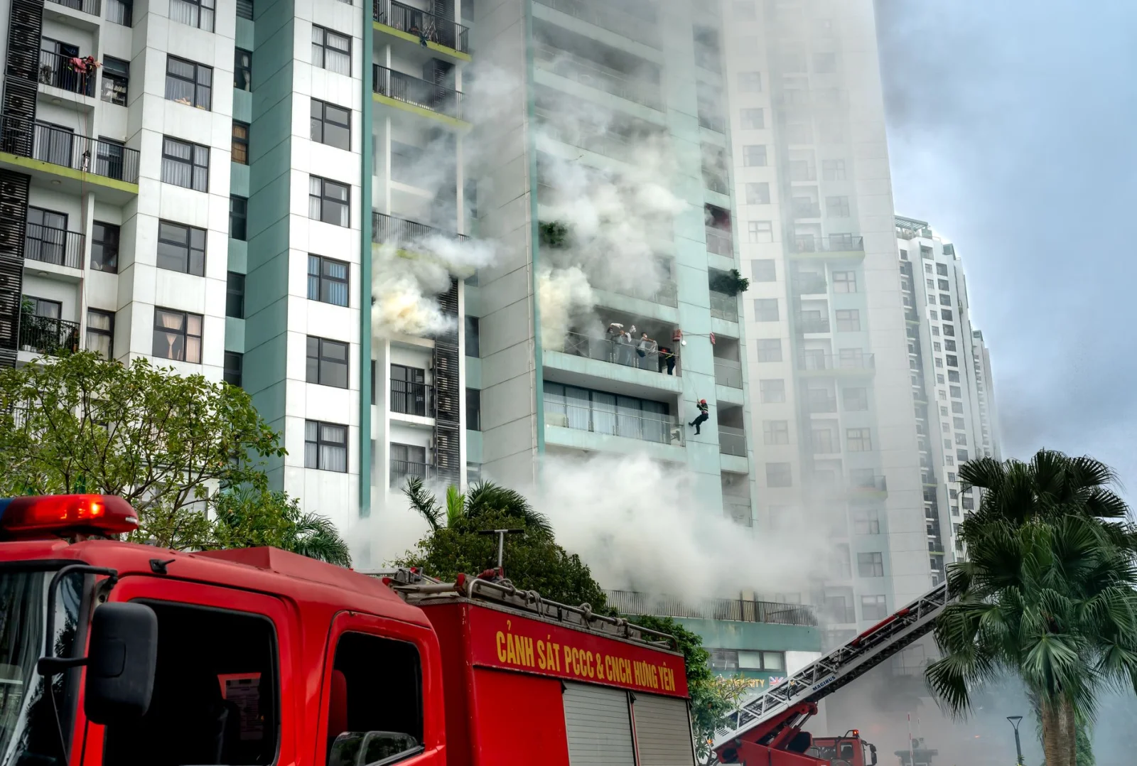 Fatal Fire on Balcony; Father and Son Transferred to Hospital